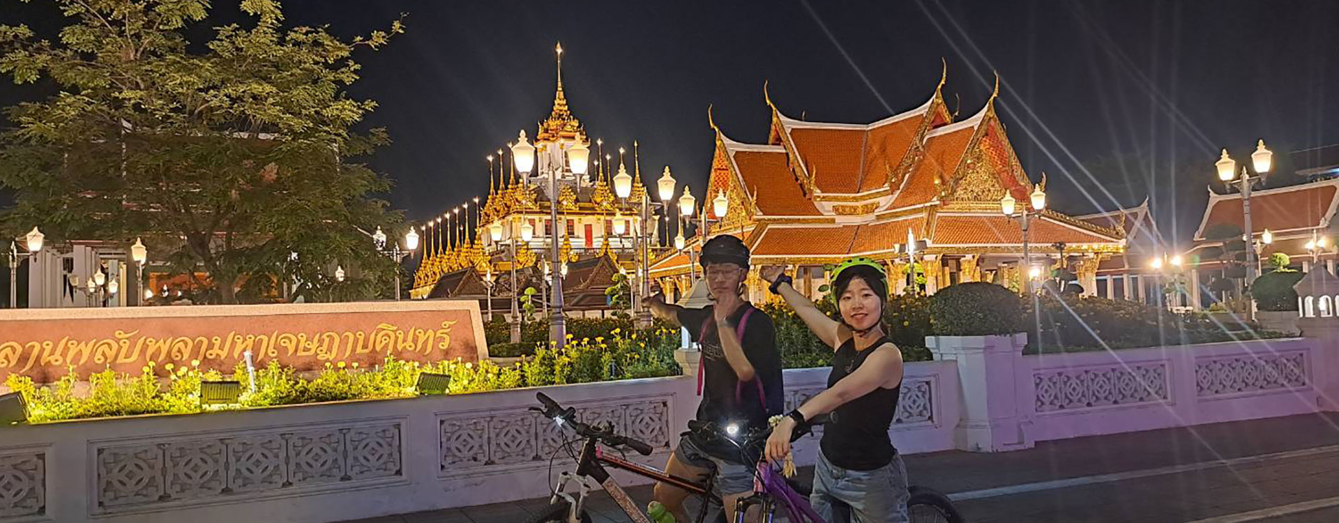Night bicycle tour visiting illuminated Bangkok temples